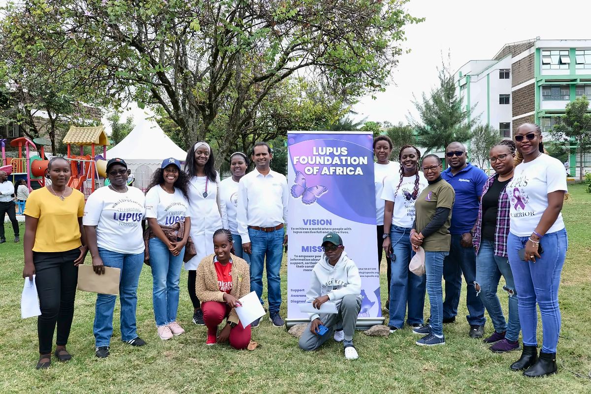 The LFA community with health partners beside the Lupus Foundation of Africa banner, several in World Lupus Day 2025 T-shirts