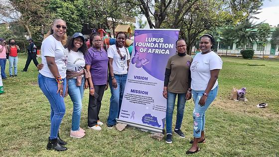 LFA members beside the Lupus Foundation of Africa banner at the Lupus Wellness &amp; Rheumatology Camp 2025