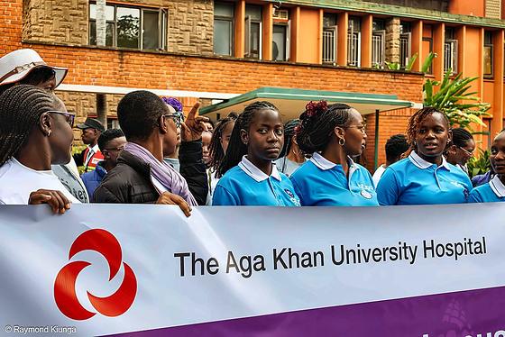 Walkers carrying The Aga Khan University Hospital banner on World Lupus Day 2026