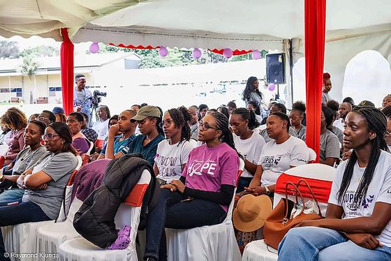 Community members listening during a session under the tent at World Lupus Day 2026