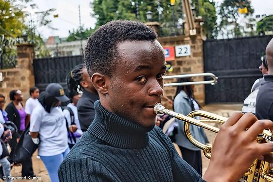 A brass band accompanying the community walk
